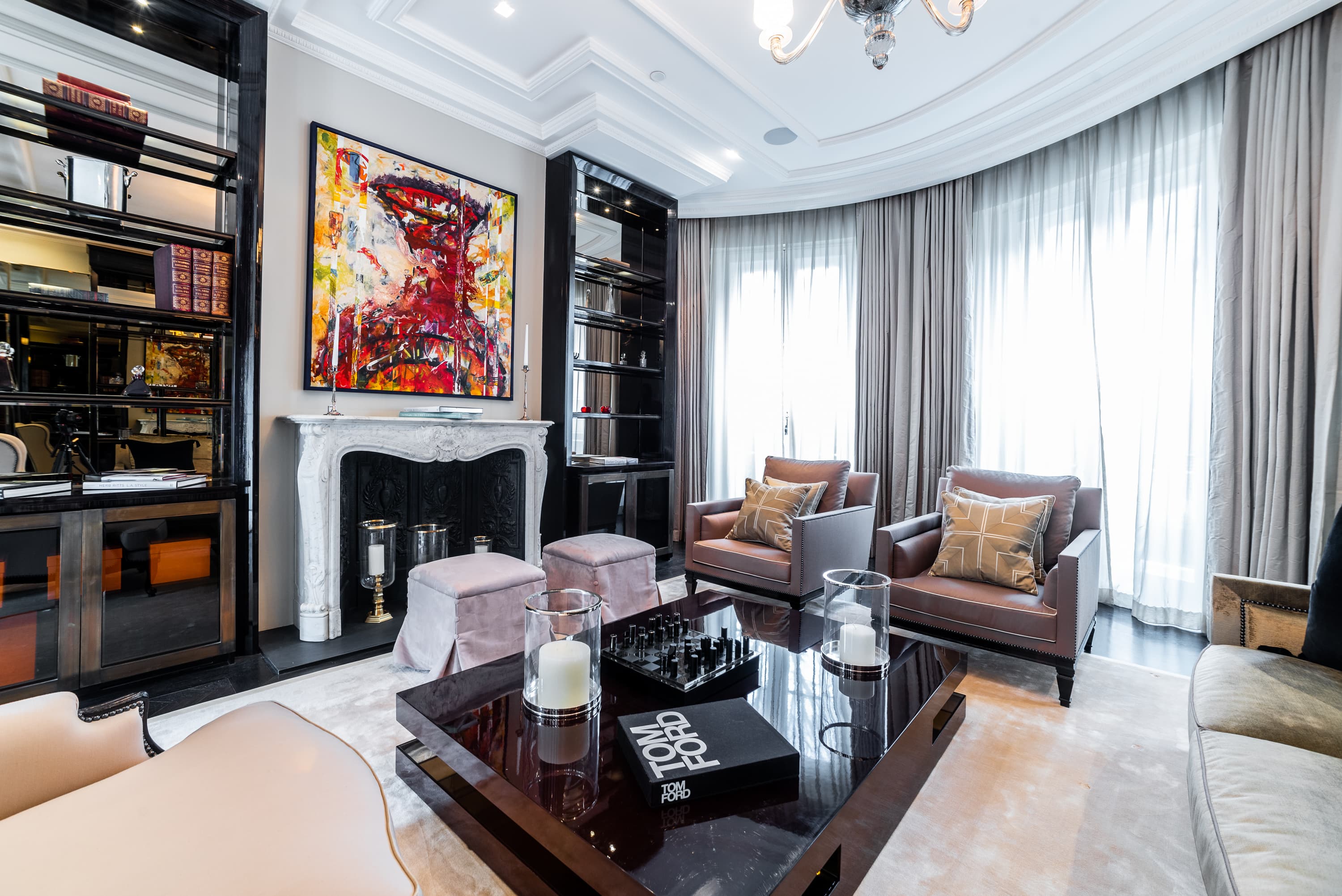 Elegant reception room with fireplace and bay windows